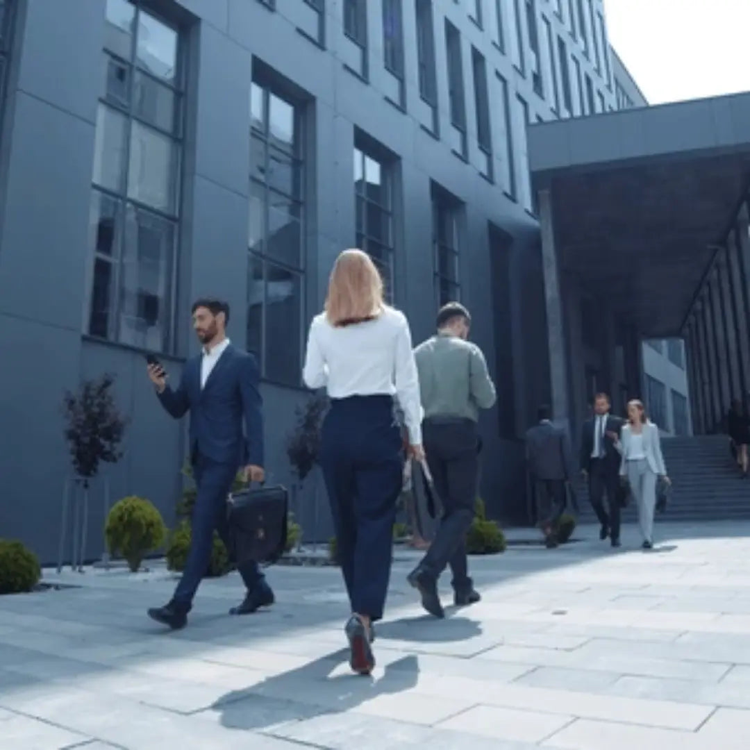 Business people walking outside a modern office building