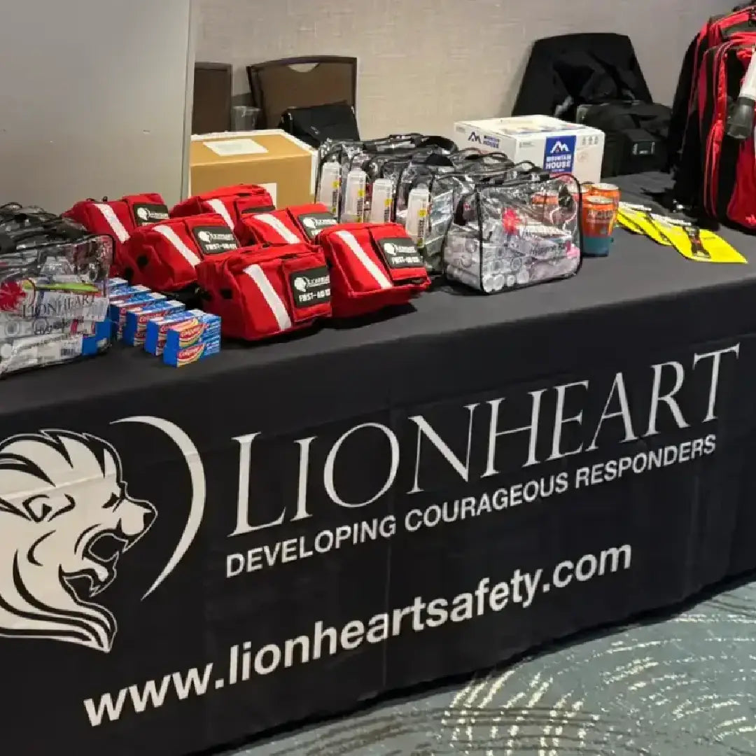 Table with safety equipment and Lionheart branded tablecloth